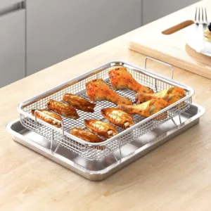 Plaque de cuisson antiadhésive avec grille en acier inoxydable utilisée pour cuire du poulet au four