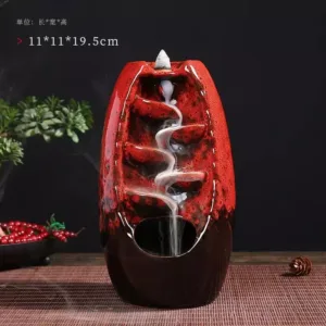 Brûleur d'encens en cascade en céramique rouge et noir avec fumée en spirale
