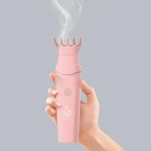 Brosse à cheveux électrique pour bakhoor diffusant un parfum dans les cheveux.