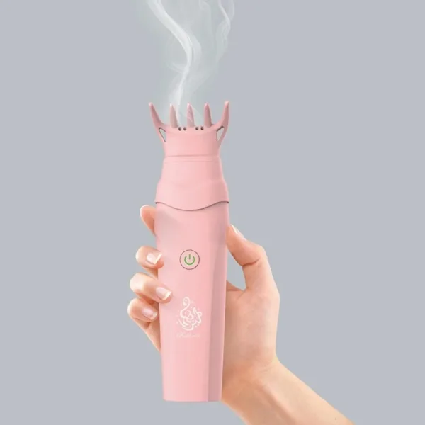 Brosse à cheveux électrique pour bakhoor diffusant un parfum dans les cheveux.