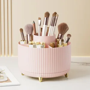 Organisateur rotatif pour maquillage rose, idéal pour ranger pinceaux, rouges à lèvres et accessoires de beauté.