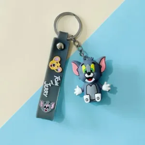 Porte clés Tom et Jerry avec figurine en silicone et lanière bleue décorative.