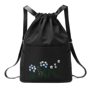 Sac à dos noir avec motif fleuri , design léger et pratique pour un usage quotidien.