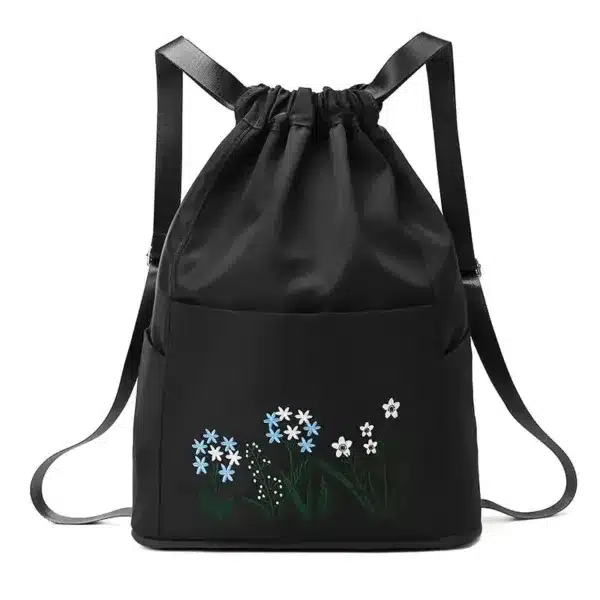 Sac à dos noir avec motif fleuri , design léger et pratique pour un usage quotidien.