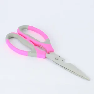 Ciseaux ergonomiques avec support magnétique pour rangement pratique.