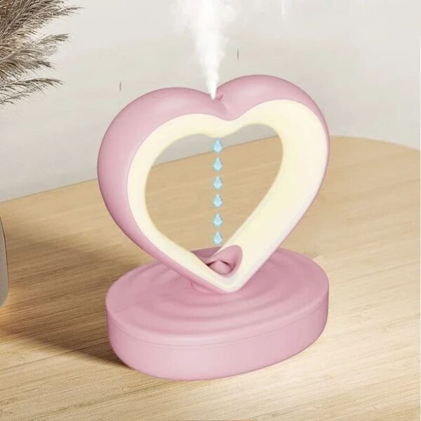 Humidificateur cœur lumineux avec éclairage LED romantique et fonction de brumisation.