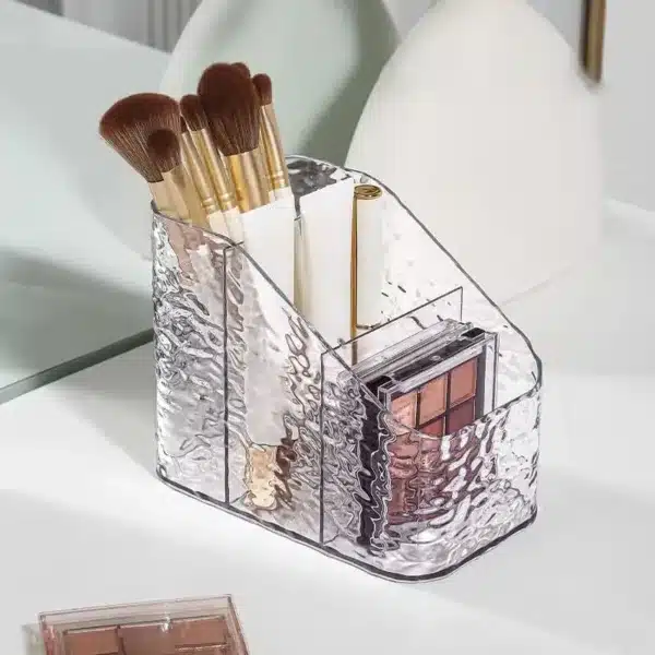 Organisateur de maquillage en acrylique transparent avec compartiments de rangement.