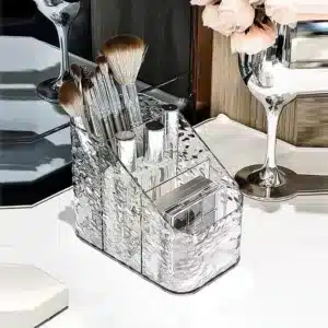 Organisateur de maquillage en acrylique transparent avec compartiments de rangement.