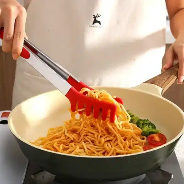 Pince de cuisine en silicone rouge avec embout dents pour attraper les nouilles facilement