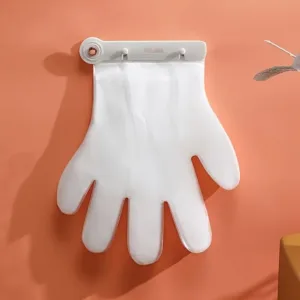 Gants jetables transparents accrochés au mur avec distributeur pratique pour cuisine ou ménage – Maroc