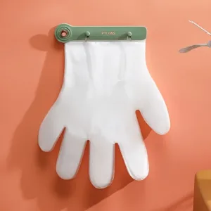 Gants jetables transparents accrochés au mur avec distributeur pratique pour cuisine ou ménage – Maroc
