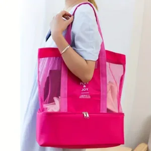 sac de plage isotherme Play & Joy en rose porté sur l’épaule