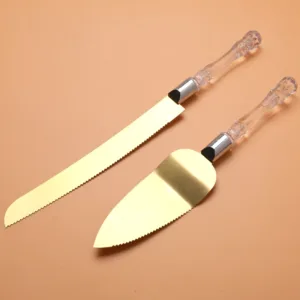 Couteau et pelle à gâteau dorés avec manche transparent élégant pour mariage ou dessert