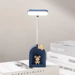 Lampe de bureau LED avec figurine dorée et base colorée