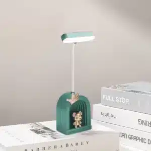 Lampe de bureau LED avec figurine dorée et base colorée
