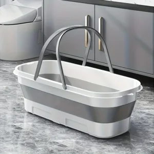 Baignoire pliante portable blanche et grise remplie d’eau