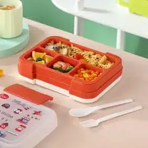 Lunch box enfant rouge avec repas équilibré – pâtes, crevettes, légumes