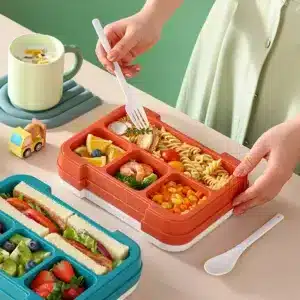Boîte à lunch enfant bleue avec sandwiches et fruits