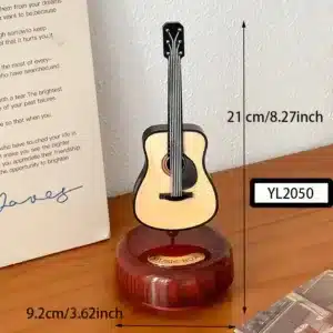 Boîte à musique en forme de guitare vintage sur socle bois