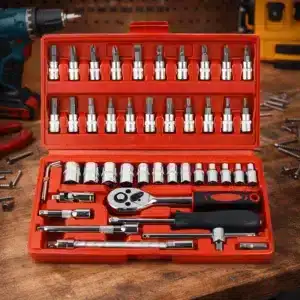 Coffret cliquet et douilles 46 pièces en mallette rouge ouvert sur un établi de bricolage