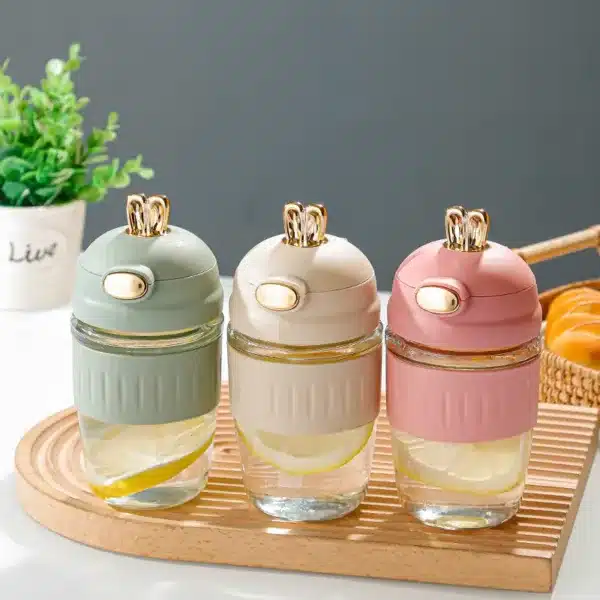 Bouteilles à eau élégantes 400 ml avec couvercle doré et paille intégrée