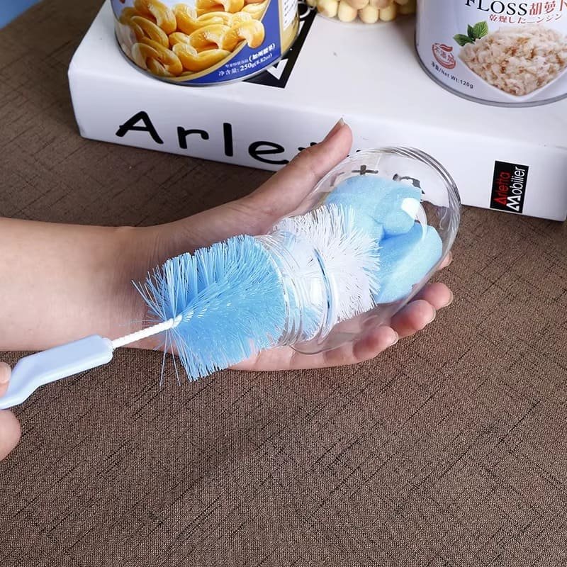 brosse-nettoyage-biberon-et-tetine-rose-1 Brosse nettoyage biberon et tétine utilisée pour nettoyer un couvercle de biberon violet