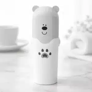 Porte brosse à dent pour voyage ouvert avec brosse et dentifrice à l’intérieur en forme d’ours