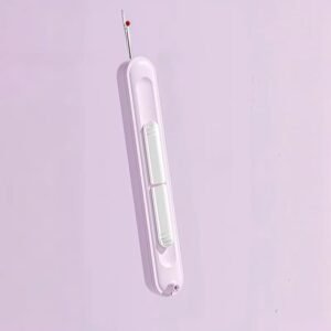 découseur couture ergonomique beige avec pointe en acier et bille rouge de protection tenu dans la main pour enlever une couture au maroc