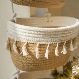 Panier suspendu bohème 3 niveaux en corde de coton pour rangement mural et décoration intérieure.