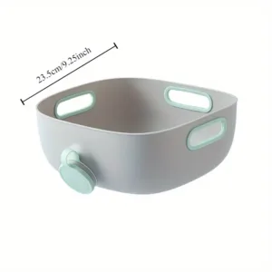 Bassine de cuisine grise avec bouchon de vidange et poignées intégrées pour laver et égoutter les fruits et légumes.