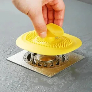 Filtre anti cheveux pour évacuation d'eau de douche avec ventouse centrale, disponible en plusieurs couleurs au Maroc.