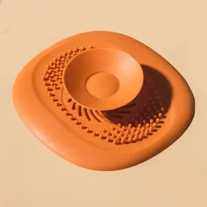 Filtre anti cheveux pour évacuation d'eau de douche avec ventouse centrale, disponible en plusieurs couleurs au Maroc.