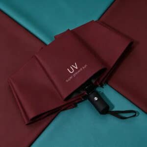 Parapluie automatique pliable anti-UV avec bouton d'ouverture et fermeture, disponible en plusieurs couleurs au Maroc.