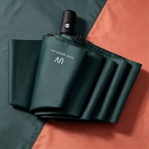 Parapluie automatique pliable anti-UV avec bouton d'ouverture et fermeture, disponible en plusieurs couleurs au Maroc.