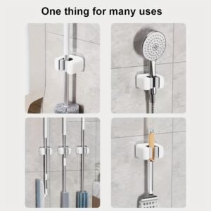 Support mural adhésif blanc et gris pour balai et serpillière avec rouleaux de maintien, fixation sans perçage.